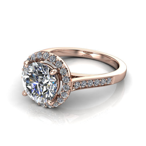 Brooke round halo engagement ring in 14K Rose Gold, three-quarter perspective showing the haloed center above a slim pav&eacute; band with a peekaboo gallery accent