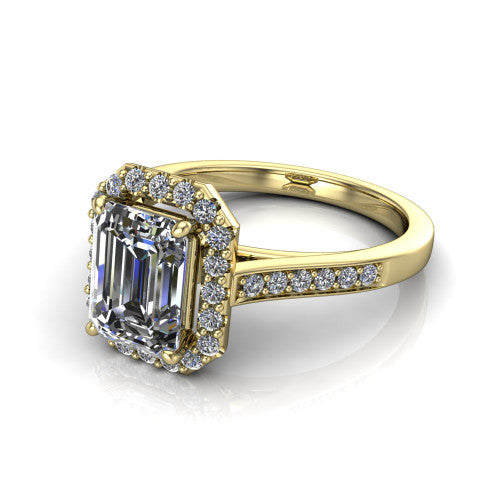Brooke emerald halo engagement ring in 18K Yellow Gold, three-quarter perspective showing the haloed center above a slim pav&eacute; band with a peekaboo gallery accent