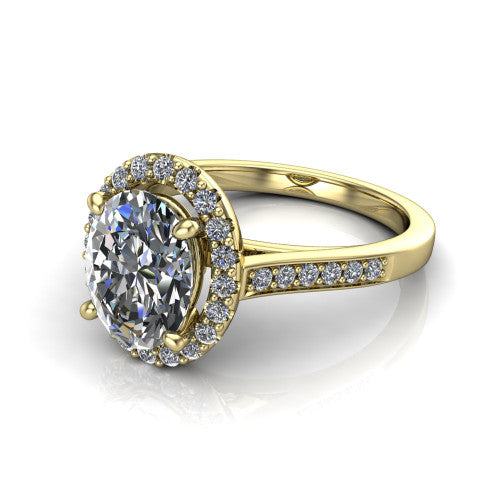 Brooke oval halo engagement ring in 14K Yellow Gold, three-quarter perspective showing the haloed center above a slim pav&eacute; band with a peekaboo gallery accent