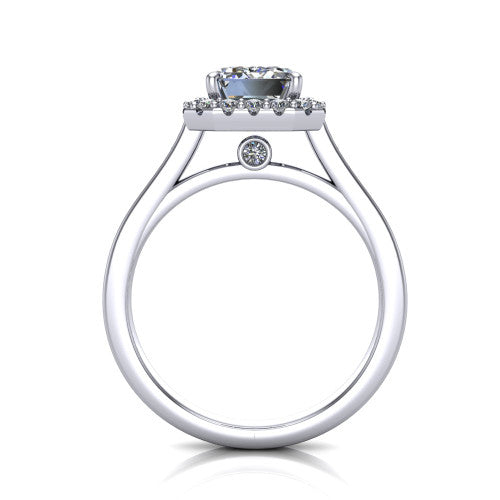 Brooke emerald halo engagement ring in 14K White Gold, through-finger front profile showing the cathedral gallery with a bezel-set peekaboo diamond beneath the center