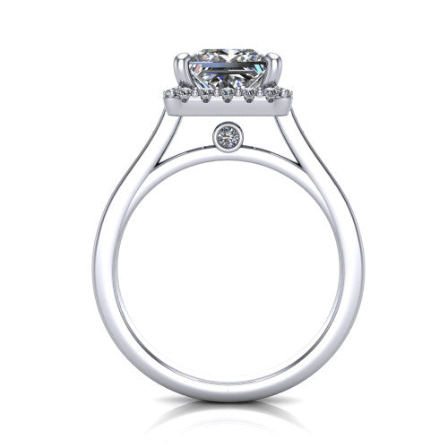 Brooke princess halo engagement ring in Platinum, through-finger front profile showing the cathedral gallery with a bezel-set peekaboo diamond beneath the center