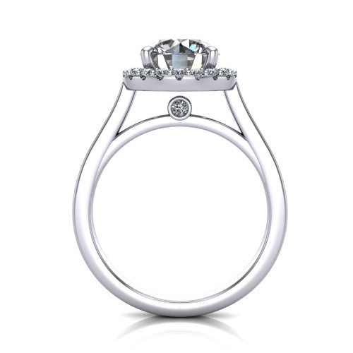 Brooke round halo engagement ring in 18K White Gold, through-finger front profile showing the cathedral gallery with a bezel-set peekaboo diamond beneath the center
