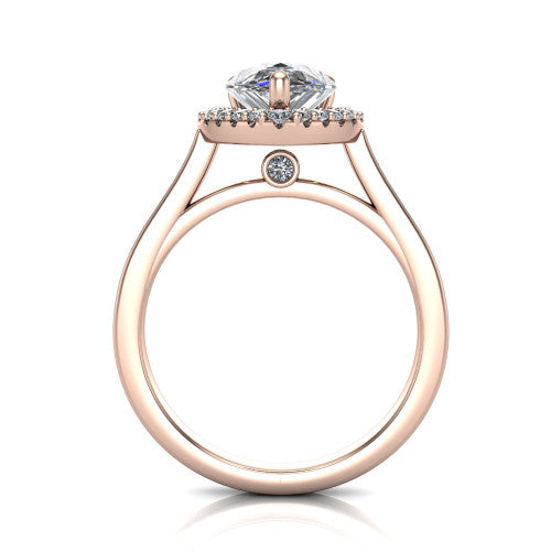 Brooke pear halo engagement ring in 18K Rose Gold, through-finger front profile showing the cathedral gallery with a bezel-set peekaboo diamond beneath the center