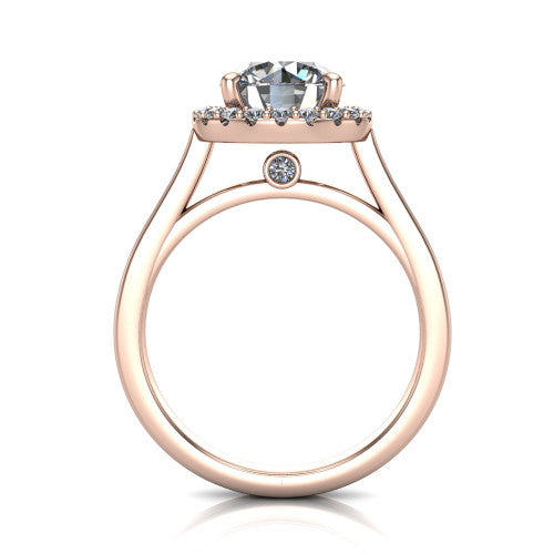 Brooke round halo engagement ring in 18K Rose Gold, through-finger front profile showing the cathedral gallery with a bezel-set peekaboo diamond beneath the center