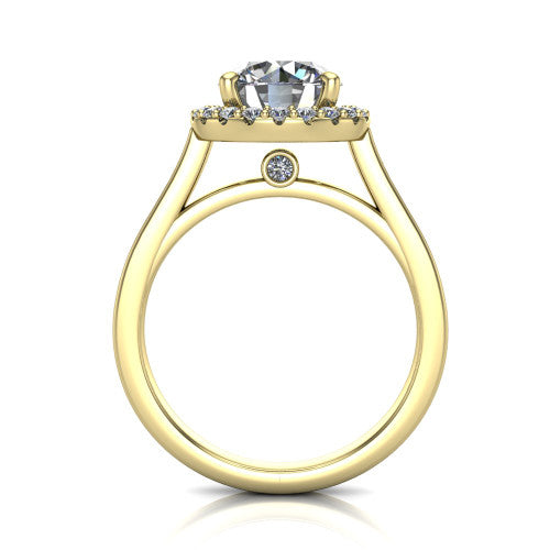 Brooke round halo engagement ring in 18K Yellow Gold, through-finger front profile showing the cathedral gallery with a bezel-set peekaboo diamond beneath the center