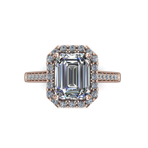 Brooke emerald halo engagement ring in 14K Rose Gold, top-down view showing the center framed by a emerald pav&eacute; halo with compass prongs