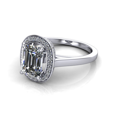 Hayden emerald halo engagement ring in 18K White Gold, three-quarter perspective showing the haloed center above a plain polished band with a peekaboo gallery accent
