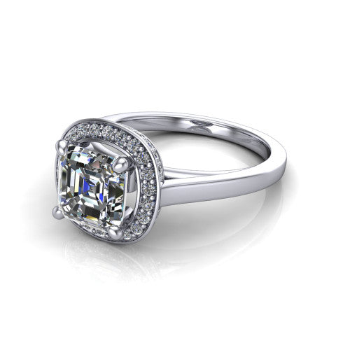 Hayden square emerald halo engagement ring in Platinum, three-quarter perspective showing the haloed center above a plain polished band with a peekaboo gallery accent