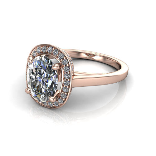 Hayden oval halo engagement ring in 18K Rose Gold, three-quarter perspective showing the haloed center above a plain polished band with a peekaboo gallery accent