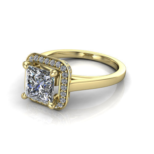 Hayden princess halo engagement ring in 14K Yellow Gold, three-quarter perspective showing the haloed center above a plain polished band with a peekaboo gallery accent