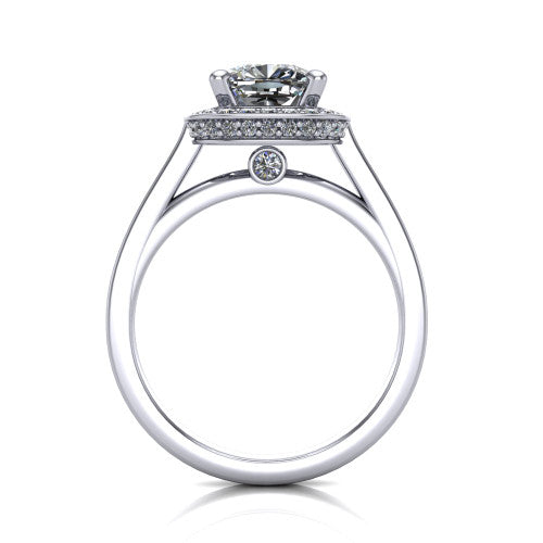 Hayden cushion halo engagement ring in Platinum, through-finger front profile showing the cathedral gallery with a bezel-set peekaboo diamond beneath the center