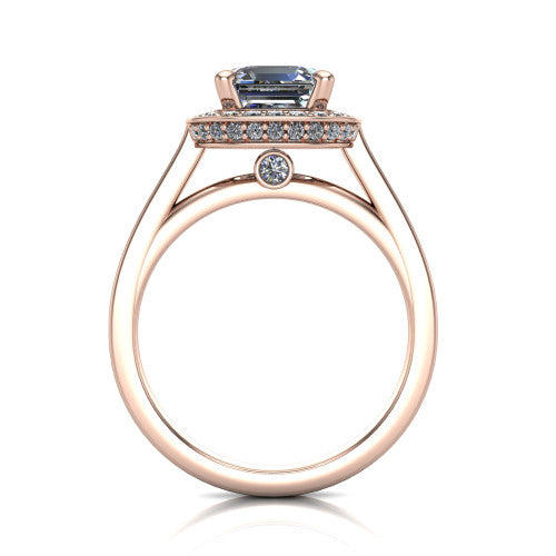 Hayden square emerald halo engagement ring in 14K Rose Gold, through-finger front profile showing the cathedral gallery with a bezel-set peekaboo diamond beneath the center