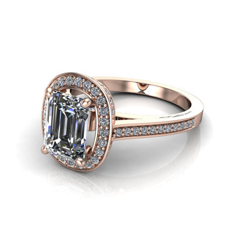 Giselle emerald halo engagement ring in 18K Rose Gold, three-quarter perspective showing the milgrain haloed center above a pav&eacute; band with a peekaboo gallery accent