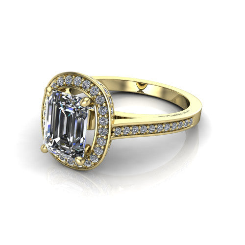 Giselle emerald halo engagement ring in 14K Yellow Gold, three-quarter perspective showing the milgrain haloed center above a pav&eacute; band with a peekaboo gallery accent