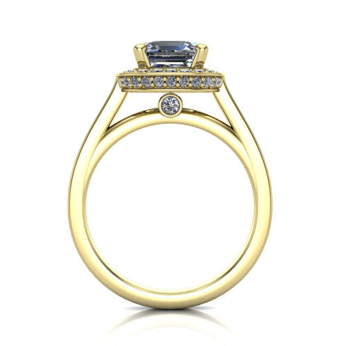 Giselle square emerald halo engagement ring in 18K Yellow Gold, through-finger front profile showing the cathedral gallery with a bezel-set peekaboo diamond beneath the center