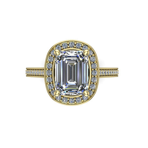Giselle emerald halo engagement ring in 18K Yellow Gold, top-down view showing the center framed by a emerald milgrain pav&eacute; halo with compass prongs