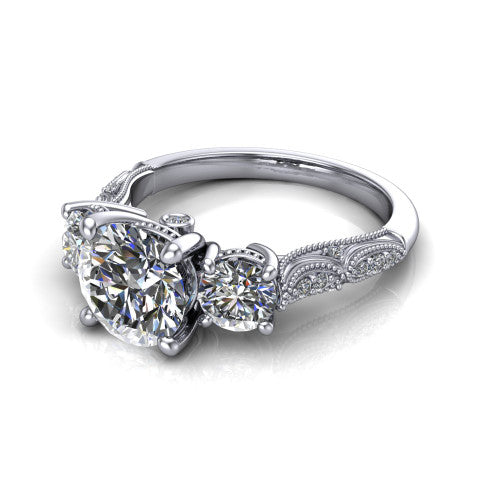 Rosemary round three stone engagement ring in Platinum, three-quarter perspective showing the three-stone row with milgrain shoulders and filigree detailing above a pav&eacute; band