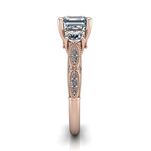 Rosemary square emerald three stone engagement ring in 18K Rose Gold, side profile showing the milgrain pav&eacute; band and vintage shoulders in profile