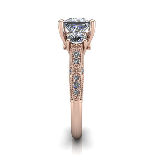 Rosemary princess three stone engagement ring in 14K Rose Gold, side profile showing the milgrain pav&eacute; band and vintage shoulders in profile