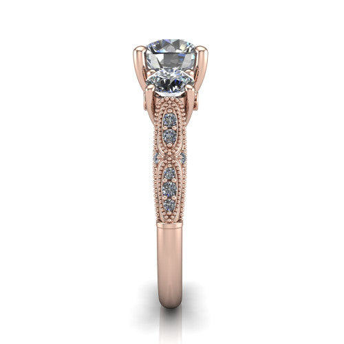Rosemary round three stone engagement ring in 14K Rose Gold, side profile showing the milgrain pav&eacute; band and vintage shoulders in profile