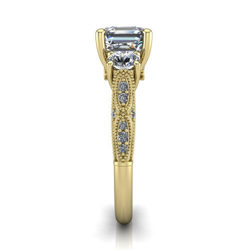 Rosemary square emerald three stone engagement ring in 18K Yellow Gold, side profile showing the milgrain pav&eacute; band and vintage shoulders in profile