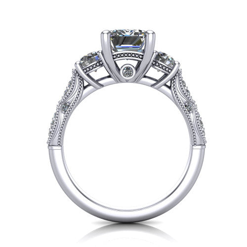 Rosemary emerald three stone engagement ring in 14K White Gold, through-finger front profile showing the filigree gallery and milgrain detailing beneath the center