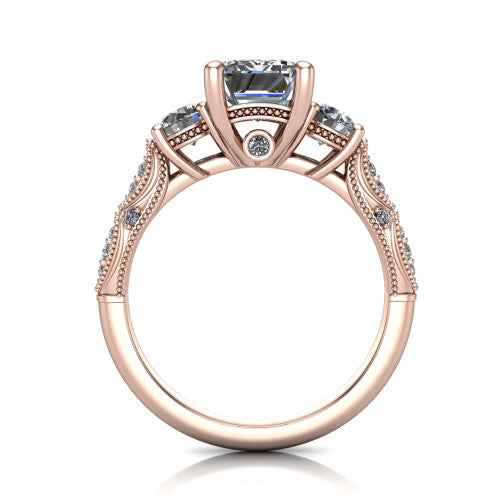 Rosemary emerald three stone engagement ring in 14K Rose Gold, through-finger front profile showing the filigree gallery and milgrain detailing beneath the center