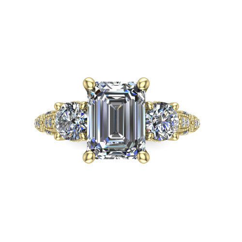 Rosemary emerald three stone engagement ring in 14K Yellow Gold, top-down view showing the center stone flanked by two round side stones from above