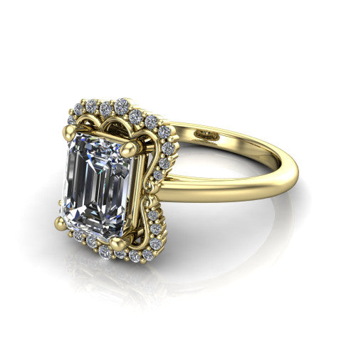 Heidi emerald vintage halo engagement ring in 18K Yellow Gold, three-quarter perspective showing the center in a quatrefoil clover halo above a plain band