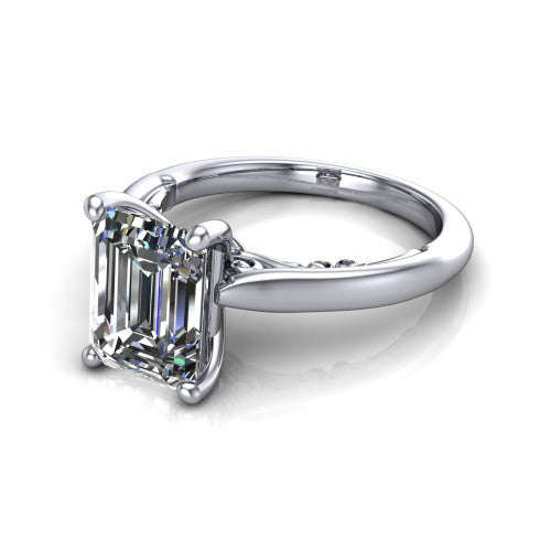 Lune emerald classic solitaire engagement ring in Platinum, three-quarter perspective showing the four-prong center above a plain band with a filigree gallery