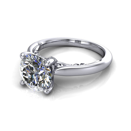 Lune round classic solitaire engagement ring in Platinum, three-quarter perspective showing the four-prong center above a plain band with a filigree gallery