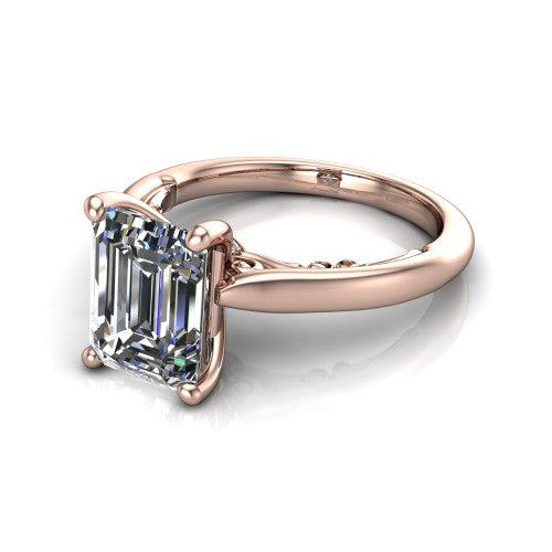 Lune emerald classic solitaire engagement ring in 14K Rose Gold, three-quarter perspective showing the four-prong center above a plain band with a filigree gallery
