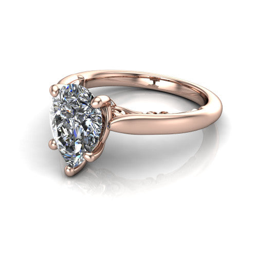 Lune pear classic solitaire engagement ring in 18K Rose Gold, three-quarter perspective showing the four-prong center above a plain band with a filigree gallery