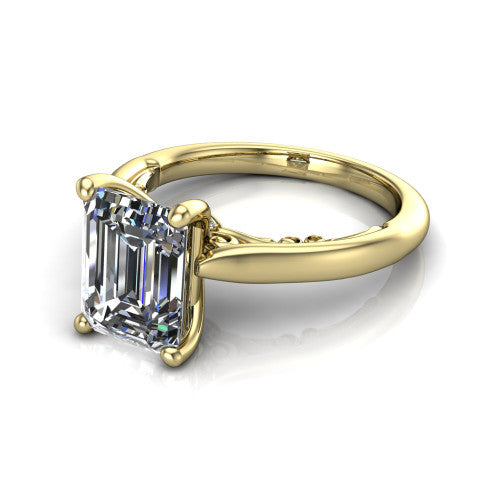 Lune emerald classic solitaire engagement ring in 18K Yellow Gold, three-quarter perspective showing the four-prong center above a plain band with a filigree gallery