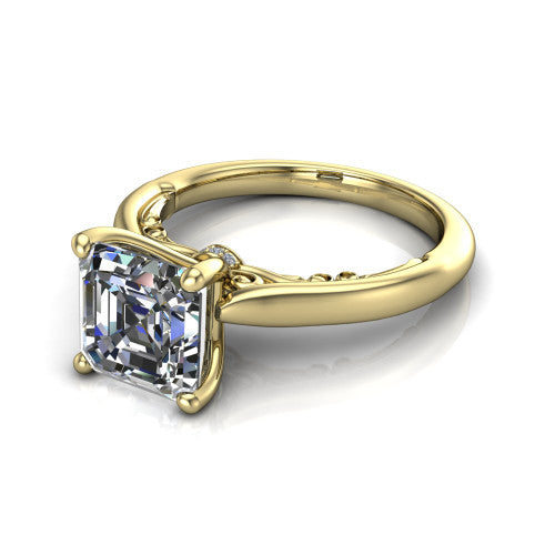 Lune square emerald classic solitaire engagement ring in 18K Yellow Gold, three-quarter perspective showing the four-prong center above a plain band with a filigree gallery