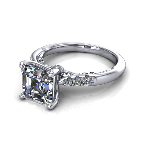 Jinnie square emerald classic engagement ring in Platinum, three-quarter perspective showing the four-prong center above pav&eacute; shoulders with a filigree gallery