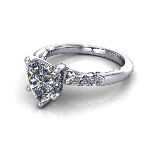 Jinnie heart classic engagement ring in Platinum, three-quarter perspective showing the four-prong center above pav&eacute; shoulders with a filigree gallery