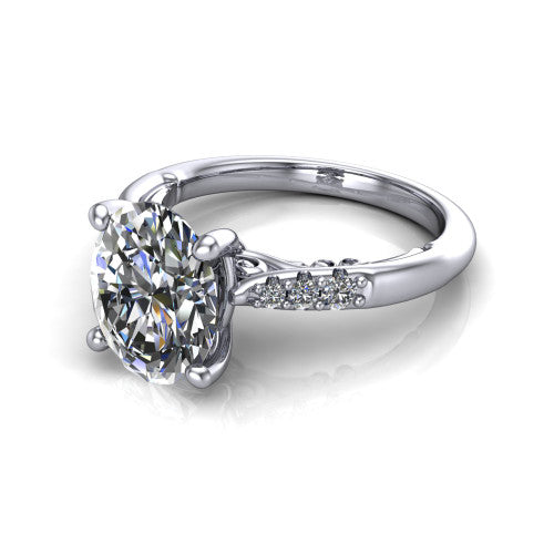 Jinnie oval classic engagement ring in 14K White Gold, three-quarter perspective showing the four-prong center above pav&eacute; shoulders with a filigree gallery