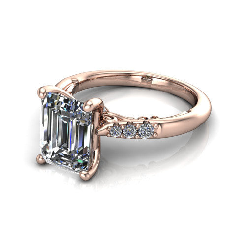 Jinnie emerald classic engagement ring in 18K Rose Gold, three-quarter perspective showing the four-prong center above pav&eacute; shoulders with a filigree gallery