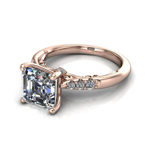 Jinnie square emerald classic engagement ring in 18K Rose Gold, three-quarter perspective showing the four-prong center above pav&eacute; shoulders with a filigree gallery
