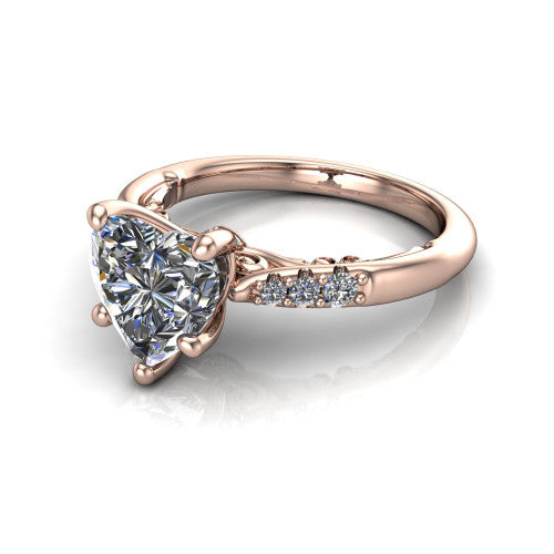 Jinnie heart classic engagement ring in 14K Rose Gold, three-quarter perspective showing the four-prong center above pav&eacute; shoulders with a filigree gallery