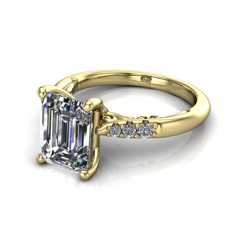 Jinnie emerald classic engagement ring in 18K Yellow Gold, three-quarter perspective showing the four-prong center above pav&eacute; shoulders with a filigree gallery