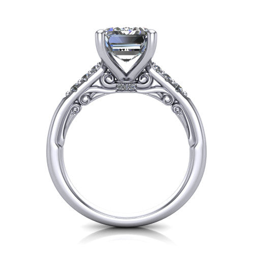 Jinnie emerald classic engagement ring in Platinum, through-finger front profile showing the scrollwork filigree gallery beneath the center