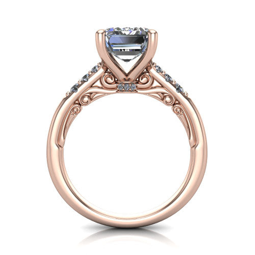 Jinnie emerald classic engagement ring in 14K Rose Gold, through-finger front profile showing the scrollwork filigree gallery beneath the center