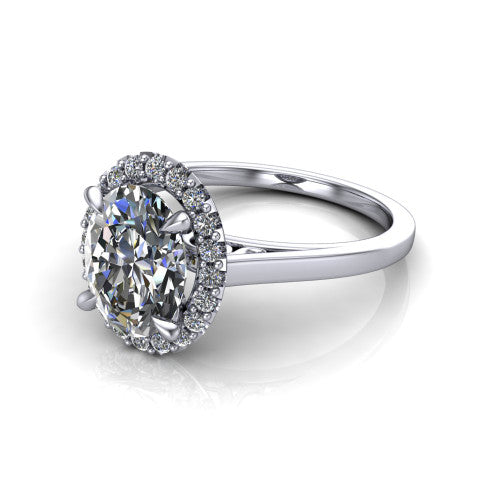 Esmeralda oval halo engagement ring in 14K White Gold, three-quarter perspective showing the haloed center above a plain band with a filigree gallery