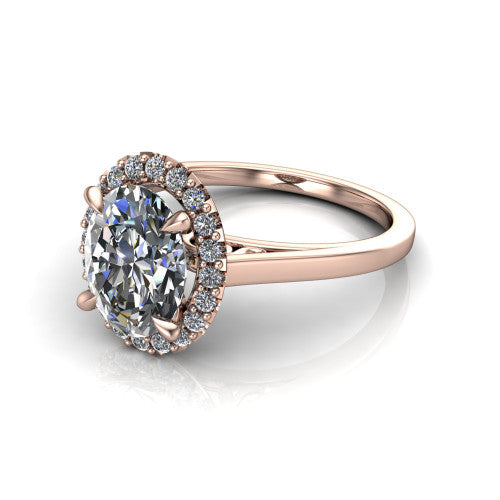 Esmeralda oval halo engagement ring in 18K Rose Gold, three-quarter perspective showing the haloed center above a plain band with a filigree gallery