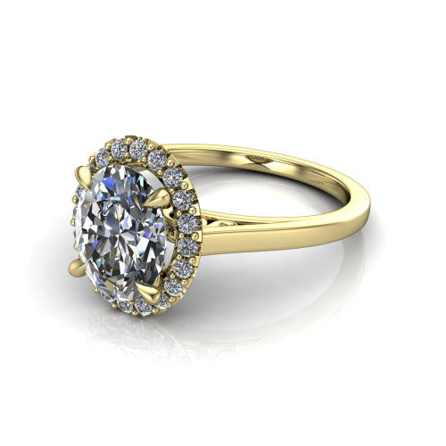 Esmeralda oval halo engagement ring in 18K Yellow Gold, three-quarter perspective showing the haloed center above a plain band with a filigree gallery