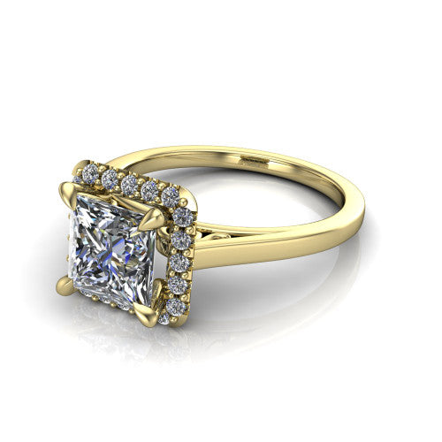 Esmeralda princess halo engagement ring in 14K Yellow Gold, three-quarter perspective showing the haloed center above a plain band with a filigree gallery