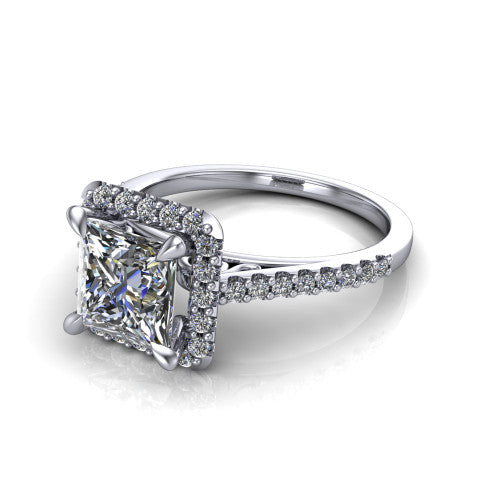 Birdie princess halo engagement ring in Platinum, three-quarter perspective showing the haloed center above a slim pav&eacute; band with a filigree gallery