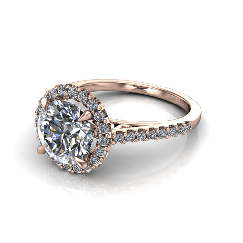 Birdie round halo engagement ring in 18K Rose Gold, three-quarter perspective showing the haloed center above a slim pav&eacute; band with a filigree gallery